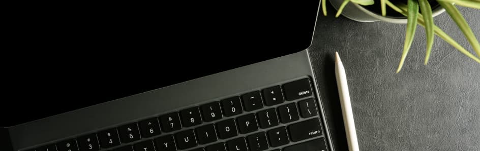 Laptop keyboard and stylus.